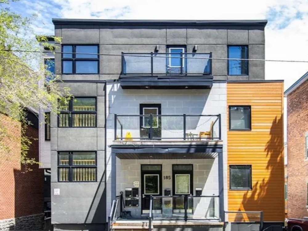 185 Henderson Avenue, Ottawa — red-brick multi-unit building with traditional architecture and front porch near downtown.