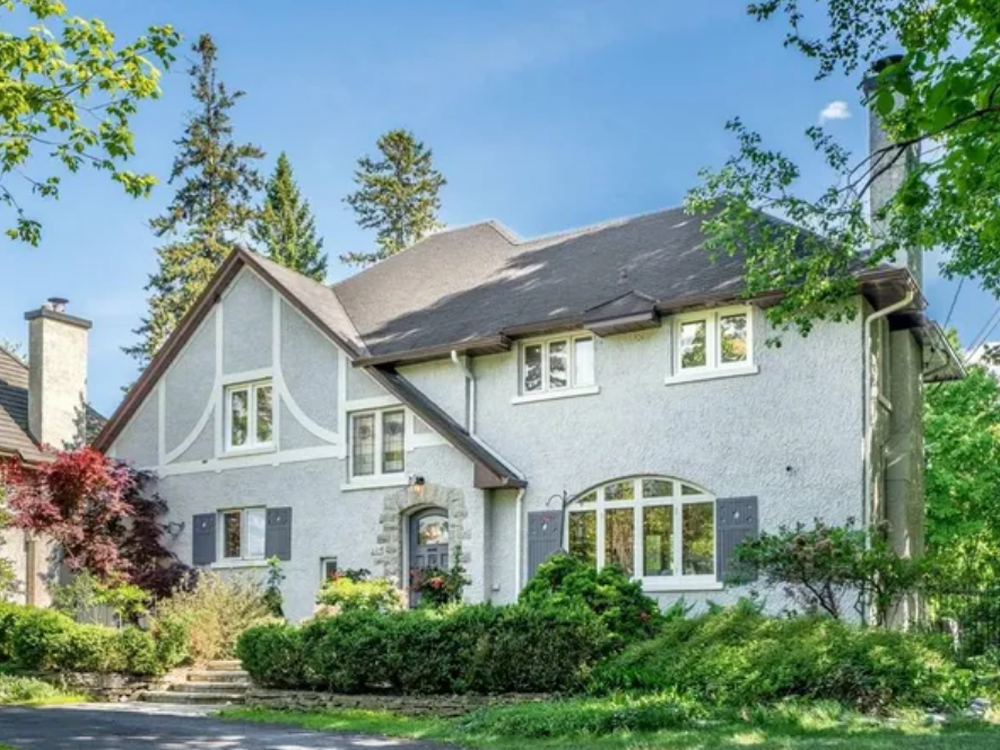 Elegant home at 224 Buena Vista Road, Ottawa, featuring a classic exterior, large front lawn, and mature trees.