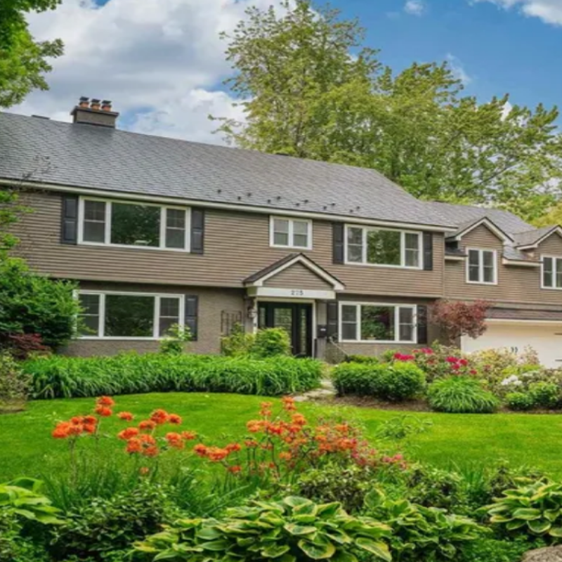 Front view of 275 Buchan Road, Ottawa — a stylish single-family home with landscaped yard and spacious driveway.