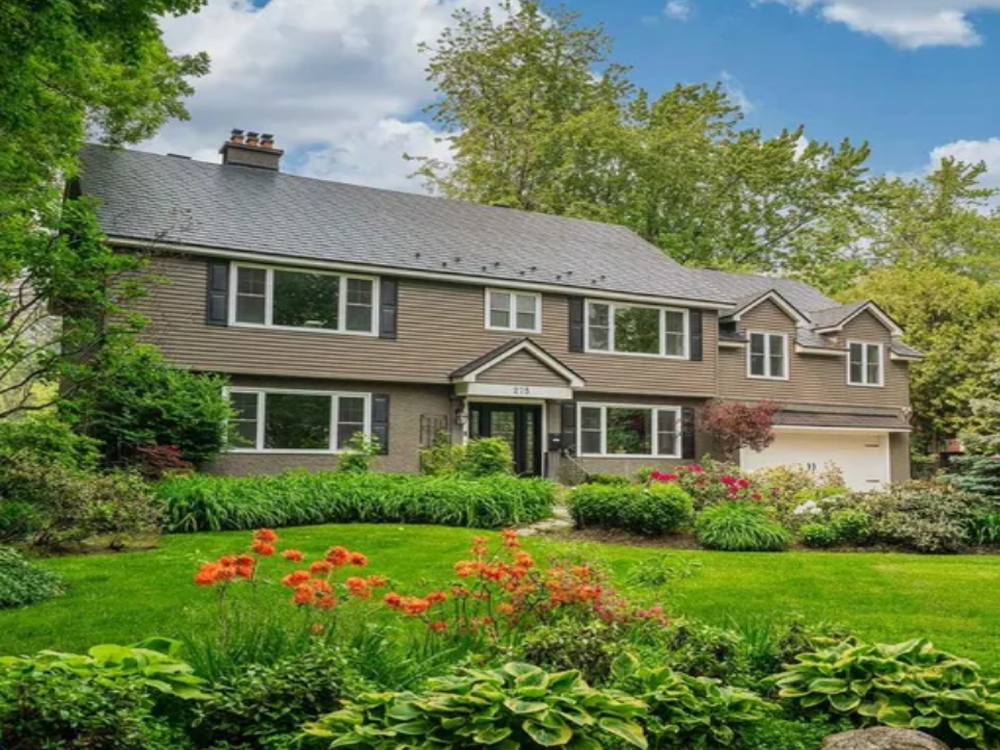 Front view of 275 Buchan Road, Ottawa — a stylish single-family home with landscaped yard and spacious driveway.