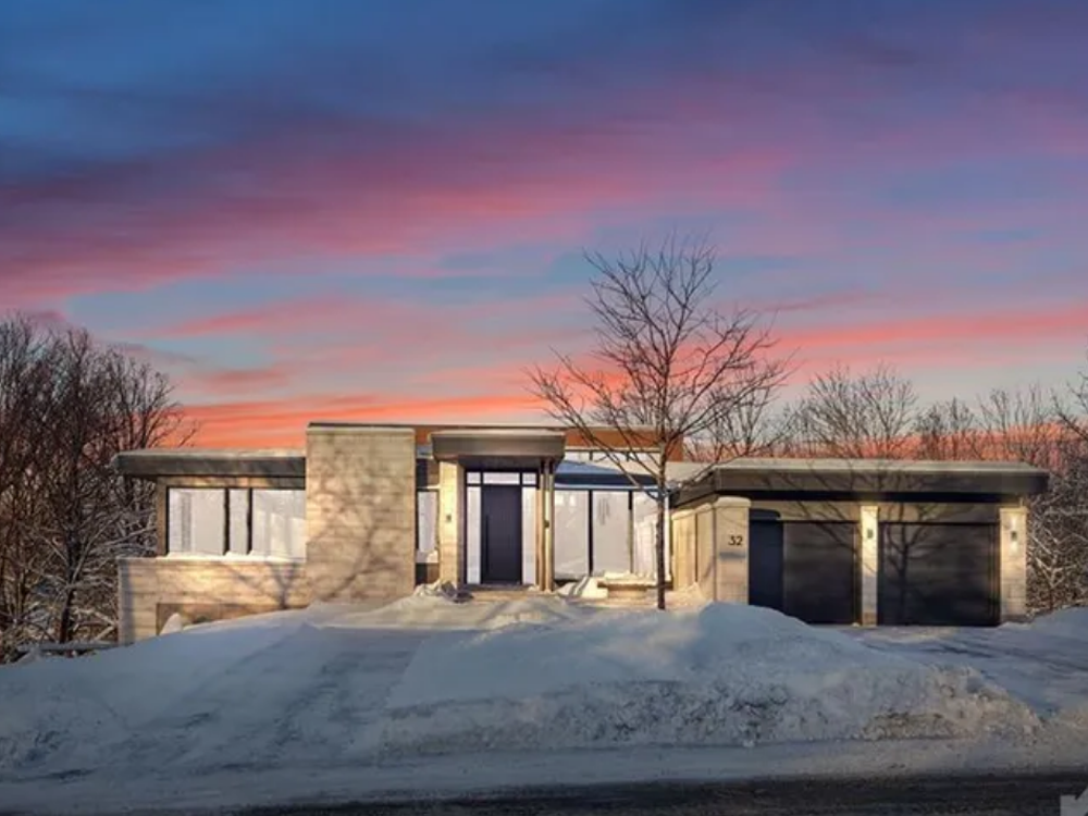 32 Clovelly Road, Ottawa — spacious detached home with brick and siding exterior, front porch, and mature landscaping in a quiet neighborhood.