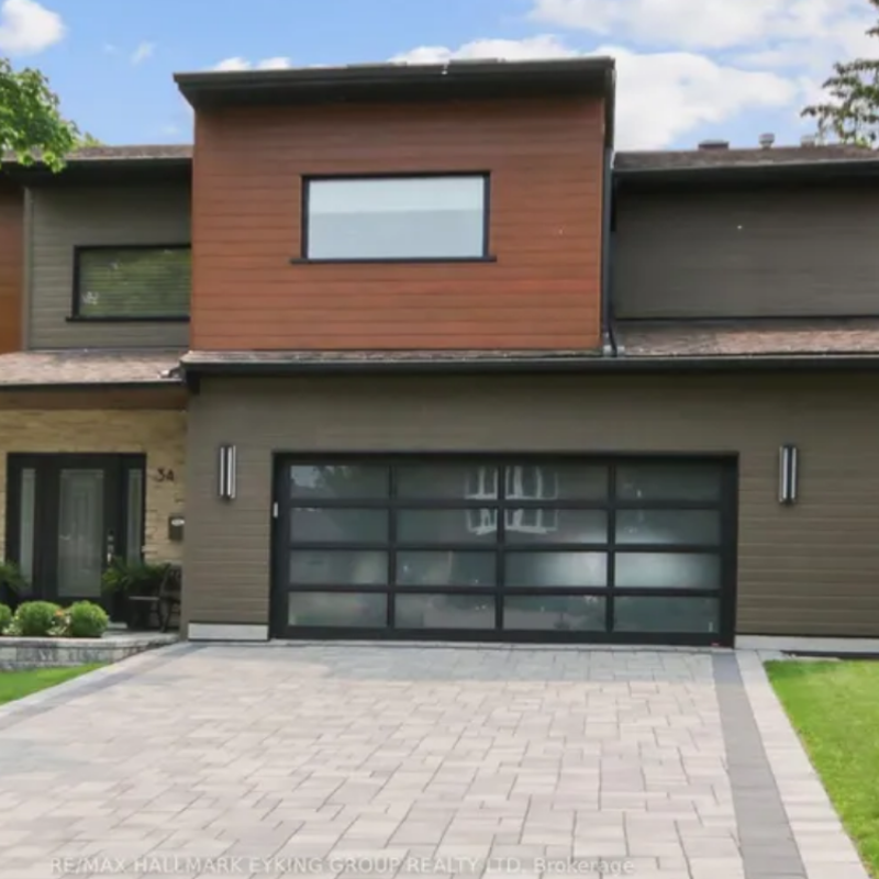 34 Rideauview Terrace, Ottawa — upscale detached home with brick exterior, large windows, and landscaped front yard in a prestigious neighborhood.