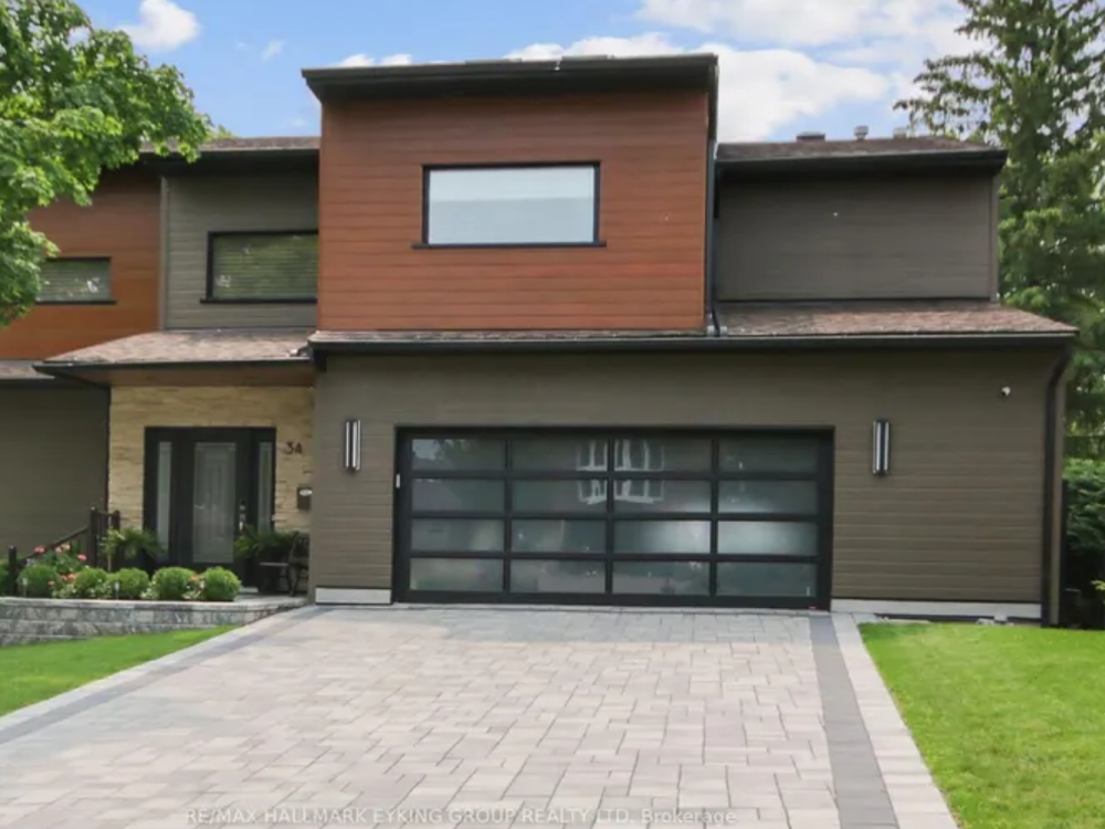 34 Rideauview Terrace, Ottawa — upscale detached home with brick exterior, large windows, and landscaped front yard in a prestigious neighborhood.
