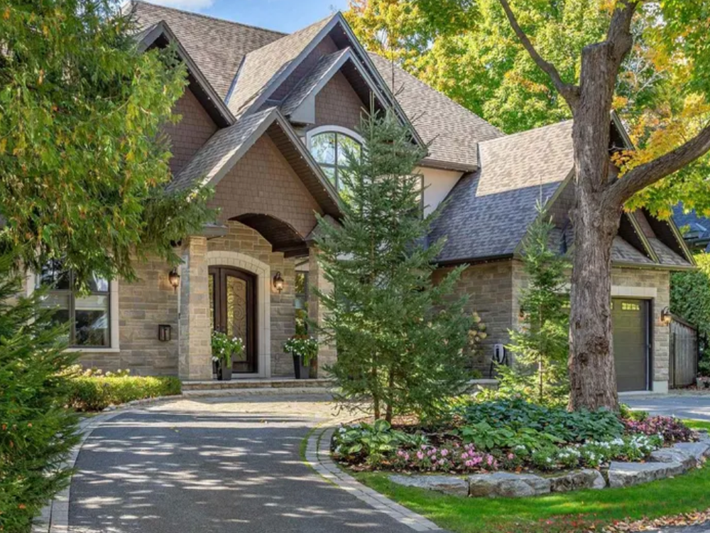77 Placel Road, Ottawa — charming detached home with brick and siding exterior, spacious front yard, and mature trees in a quiet neighborhood.
